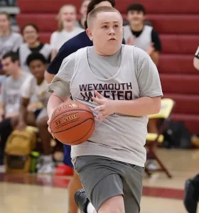 Weymouth High player Kenny Pratt drives to the basket for a layup. The Weymouth High Unified Basketball team hosted Walpole on Monday, Oct. 3, 2022.