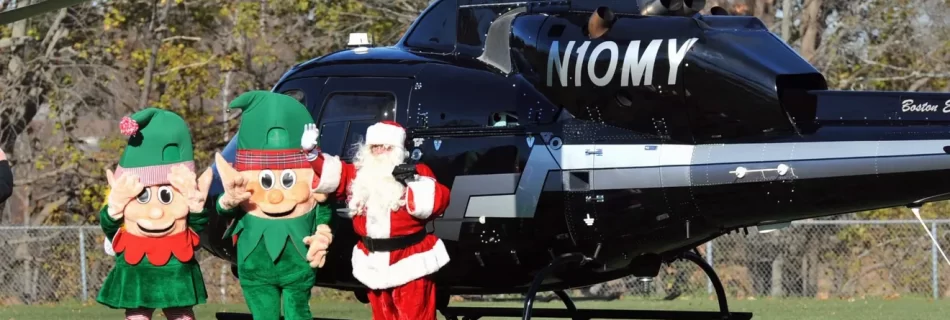 Santa Claus arrives with his elves as hundreds of spectators greet them at Pageant Field in Quincy, on Saturday, Nov. 26, 2022.